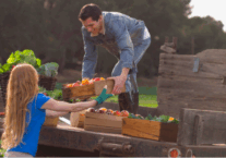 Unloading produce from a transport fleet.
